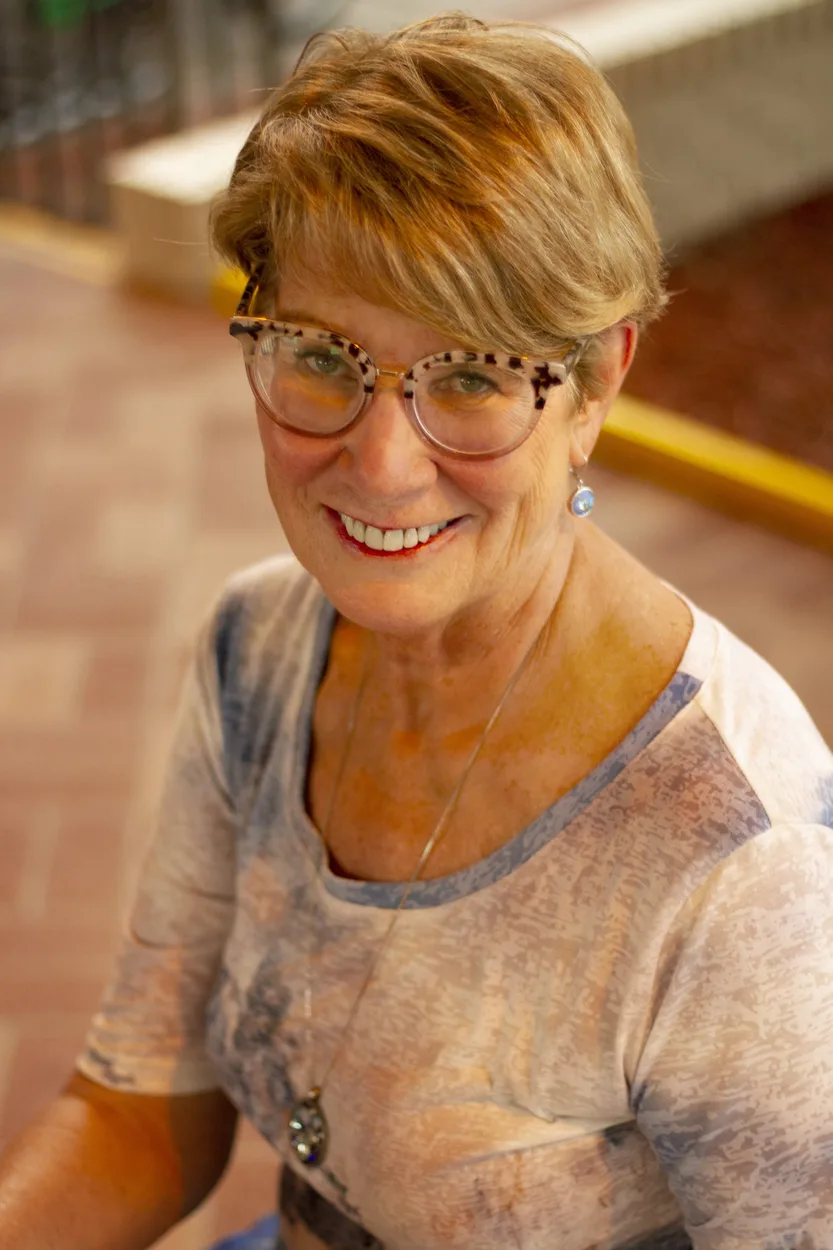 Debbie Cooley, Florida mortgage broker, smiling outdoor portrait
